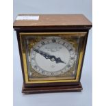A Garrard & Co LTD of Regent Street Wooden Mantle Clock with Ornate Face and Works by Elliott. Circa