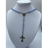 Silver rosary with pale blue clear stones, 26" long ,having silver crucifix and medallion,