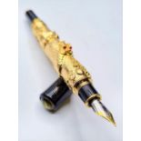 A Chinese writing black pen with an 18ct gold filled Chinese dragon with red Gem eyes. Length