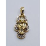 9ct gold pendant encrusted with diamonds and having 4 citrine stones, weight 2.4g
