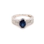 18k white gold ring with 1.20ct oval natural dark blue sapphire (Madagascar) and 0.10ct diamond