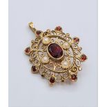 Victorian 9ct gold pendant with seed pearls and garnets. weight 4.8g and length 3cms