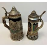 2 Bavarian style musical tankards with lids. 22x24cms tall.