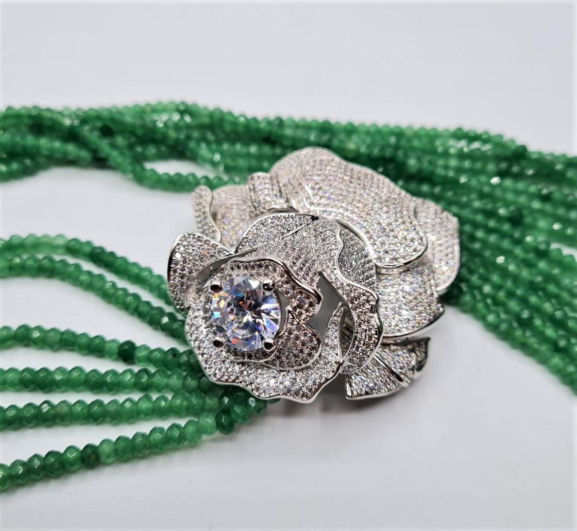 An impressive six row faceted emerald necklace with a white metal and cubic zirconia ornamental - Image 2 of 4