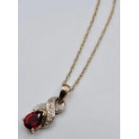 9ct Gold Pendant and Chain Having a Pear Shaped Garnet on a Delicate 9ct Gold Chain. Chain 40cm