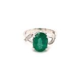 18k white gold ring with 3.4ct Zambian oval green emerald and twisted shoulder side diamonds (G/I,