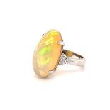 18k white gold ring with 8ct oval Ethiopian Opal cabochon with 3 diamonds on each side (total 0.47ct