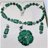 A malachite and silver (stamped 925) necklace and earrings set in a presentation box. Necklace