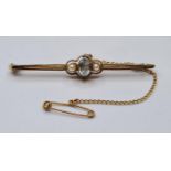 Antique 15ct Gold Bar Brooch, Having a Topaz to centre bordered with Seed Pearls .Safety Chain