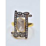 An antique yellow and white metal (untested) ring with a central rough (uncut) natural diamond (