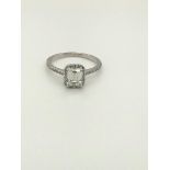 1.20ct emerald cut diamond ( G/VS1) ring in 18k gold; 2.3G; size L1/2 Plus halo and shoulders -