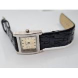 Ladies ?Jane Shilton? wristwatch having square face and black plaited strap. Full working order.