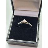 18ct white gold ring. Having a solitaire diamond of 28ct. Full UK Hallmark showing London 18ct gold.