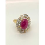 18k yellow gold ring with ruby around 3-4cts 11.5x9mm glass filled, with diamonds over 1ct; 7.3G;