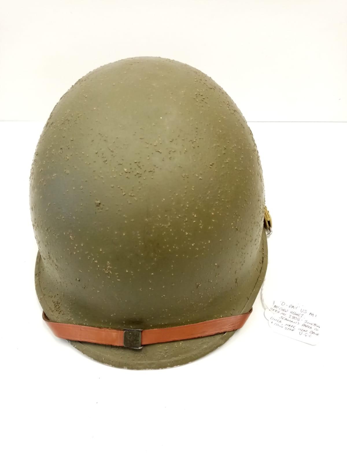 WW2 D-Day US McCord M1 Helmet. Batch No:280G which dates June 1944. Complete with a Seaman?s Paper