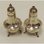 Hallmarked London (H.A. 1930) Silver salt and pepper pot. Scalloped feet