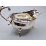 Antique Silver Sauce Boat by Mappin & Webb. Standing on three cabriole legs, having fluting to rim