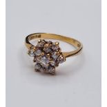 9ct Gold Stone Set Ring Having A Cluster Setting of Sparkling Clear Stones. Full UK Hallmark, Size