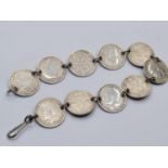 Vintage silver coin bracelet having 10x silver threepenny pieces linked together with white metal