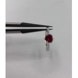 18k white gold solitaire with ruby in heart shape ( ruby 5x5x3mm); ruby could be synthetic; not
