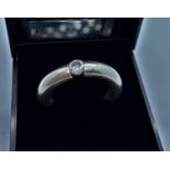 Stone set silver ring consisting a wide and thick silver hoop with single Zirconia to top size N