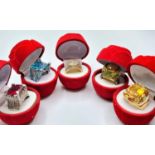 Five silver (stamped 925) rings with various gems in ?velvet red rose? presentation boxes.