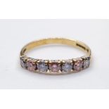 9ct Gold Ring having coloured stones to top band. Test as tourmaline. Dainty and Silm. Full UK