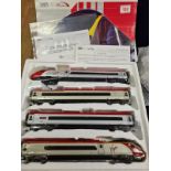 Dapol electric model train comprising engine plus 3 carriage with virgin liveny. OO gauge with