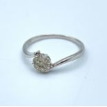 9ct White Gold crossover Ring with 0.25ct diamonds cluster, weight 1.3g and size M