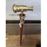 A three piece collapsible walking stick with a concealed 3 draw Telescope in the brass head. A