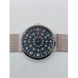 An unusual paidu rotating dial watch on steel mesh strap