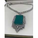 Attractive necklace with simulated emerald (36x25mmm) and sapphires marked 18KGL, designed and