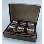 6x good quality white metal Napkin Rings in satin lined presentation box.