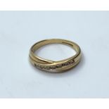 9ct gold ring with 0.25ct diamonds in crossover design, weight 1.75g and size M/N