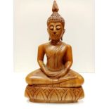 A wooden statue of a Buddhist God hand carved. 44cms tall & weight 2.25kg