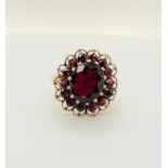 9k yellow gold ring with garnets; Centre garnet is 12x9mm; 6.13g; size Q (ECN 761)