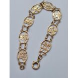 14ct gold bracelet having Chinese symbols for health, happiness, wealth, love, luck and peace. 5.6