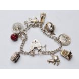 Silver Charm Bracelet with A Charms . 30g 16cms