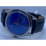 A HMT Janata wrist watch with mechanical movement and leather strap. Rare blue faced model.