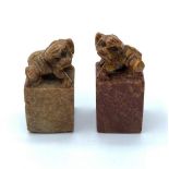 An antique, near pair, Chinese, hand carved, seal stones of fu dogs. Height: 4.5 & 5cm.