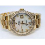 18ct Rolex Day-Date 36mm Costumed Diamond Shoulders and Bezel. 1987 Model. Come with box, no paper.