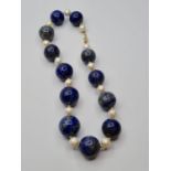 Large lapis lazuli and pearl necklace designed and owned by 'Cher'. Weight 3.8g and length 25cms