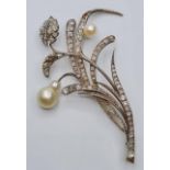 Platinum and diamond flower brooch with pearl blooms, weight 11.12g & 7cms long