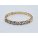 18CT Y/G DIAMOND HALF ETERNITY RING CLAW SET WITH 0.20CT DIAMOND AND WEIGHT 1.6G SIZE N