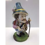 A Derby style Falstaff figurine. Damage to walking cane.