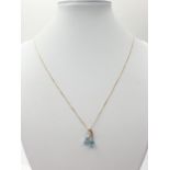 9CT Y/G BLUE TOPAZ SET PENDANT ON CHAIN, WEIGHT 1.8G AND 47CM LONG APPROX