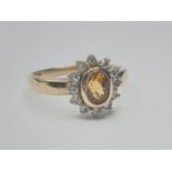 9ct gold RING having faceted natural topaz mounted to top. Zirconia surround. Full UK Hallmark for