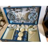 A 1960's picnic set to include 2 thermos flasks, air tight containers, cutlery and crockery