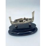 Silver Viking longboat mountain and wooden plinth, 12cm long and 7cm high