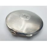 Vintage silver compact. Engine turned design to top. Initialled cartouche and inscribed to base.